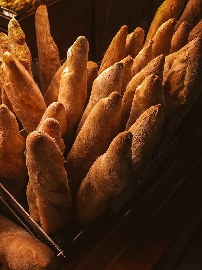 Golden baguettes displayed in a bakery, perfect for a delicious breakfast.